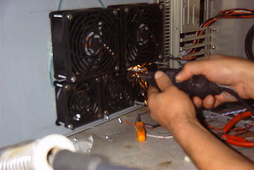Fans installed - cutting off excess bolt