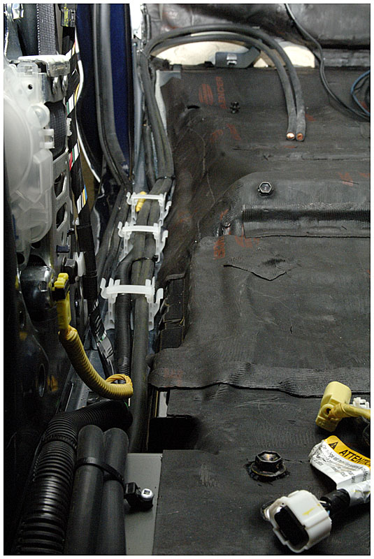Cable run down passenger side cable trough